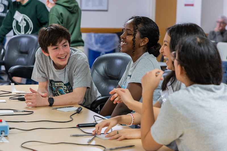 Students at a desk.